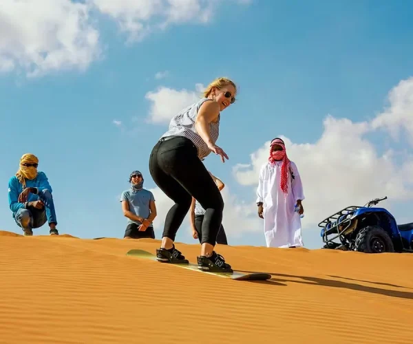 women doing sandboarding